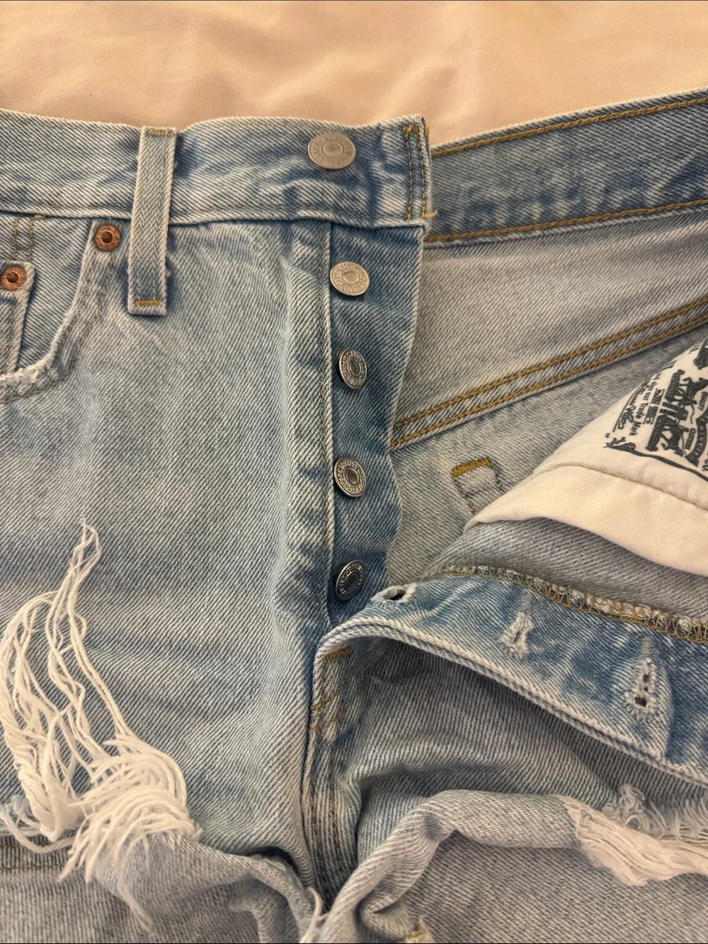 Classic Light Blue Distressed Levi’s Denim Shorts - Women